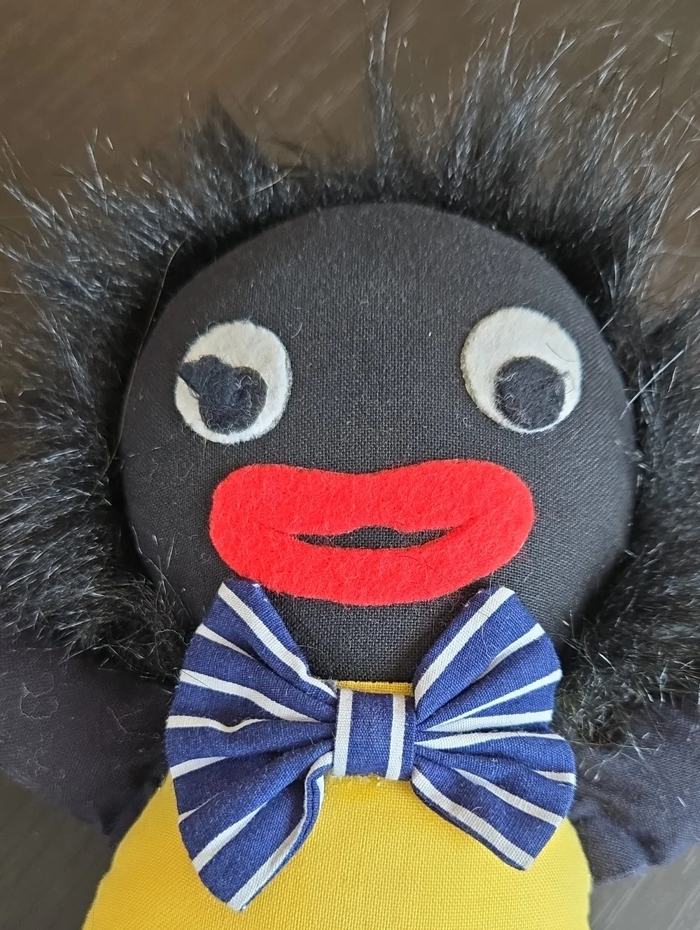 Classic Plush Doll in Black with Yellow Top and Blue Striped Pants